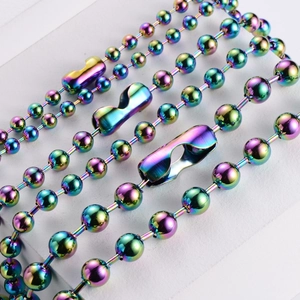 Macro shot of colorful iridescent bead chain necklaces with glossy metallic finish