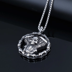 Gothic skull motorcycle engine pendant in silver stainless steel on black background
