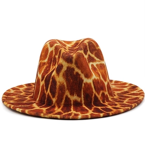 Macro detail of giraffe print fedora hat featuring textured brown animal patterns