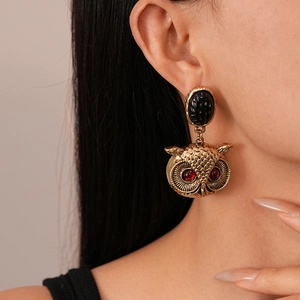 Vintage gold owl drop earrings with red gemstone eyes and black oval charms for women
