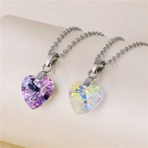Ocean Heart necklaces with purple and iridescent heart crystals on a beige display
