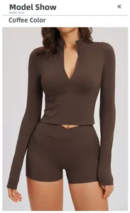 Detail of coffee brown yoga set featuring high-waist shorts and full-zip cropped top