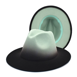 Detail of gradient fedora hat showing mint green crown transitioning to black brim