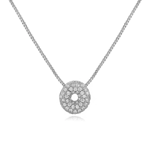 Close-up of silver box chain necklace with a round pendant pavé-set with clear cubic zirconia