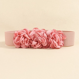 Detail of three pink satin roses on a stretchy elastic waistband for women