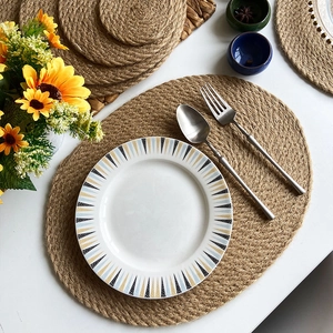 Natural woven jute heat resistant placemats in round and oval shapes for dining table