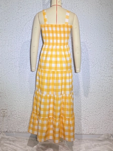 Detail of yellow and white gingham back design with elastic ruching on layered dress