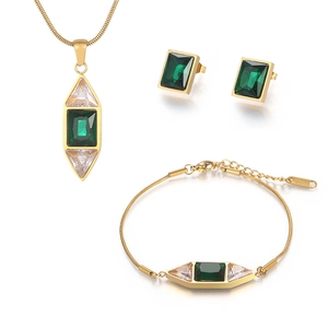 Gold stainless steel jewelry set with emerald green and white triangle gemstones