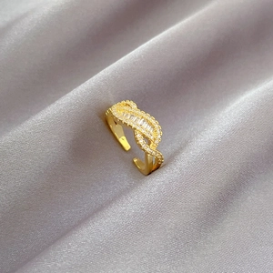 Exquisite gold-plated adjustable ring with intertwined zircon and baguette crystals