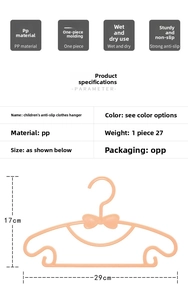 Detailed view of child-sized bow hanger with precise 29x17cm measurements for baby clothes