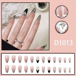French leopard print press-on nails with heart rhinestones and pearls on almond shape