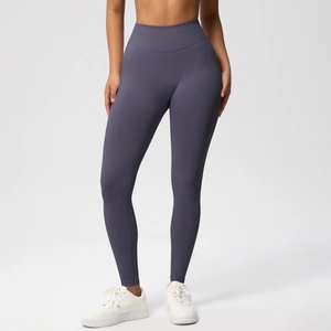 Macro shot of dark mauve high-waisted seamless yoga pants showing breathable fabric texture