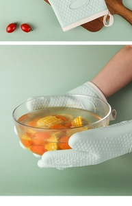 Macro detail of heat-resistant silicone gloves with non-slip texture for safe kitchen use