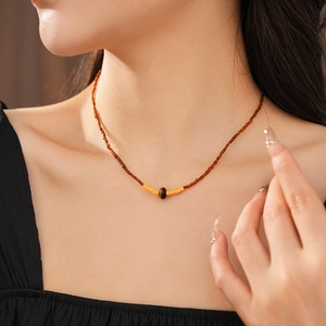 Tiger eye stone pendant necklace on model showing vintage beaded necklace design details