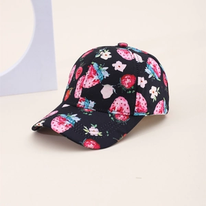 Close-up of strawberry and flower print on children's black baseball sun cap