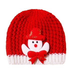 Detail of red winter knit hat for babies featuring a 3D snowman with a golden bow