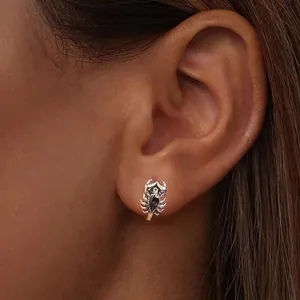 Vintage S925 silver scorpion stud earring featuring iridescent colorful gemstone on model