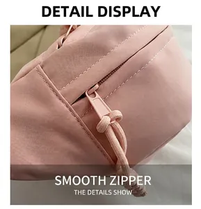 Detail of smooth pink fabric texture and high-quality zipper on this outdoor travel bag