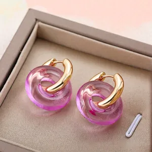 Minimalist gold stainless steel hoop earrings with transparent pink resin ring charms