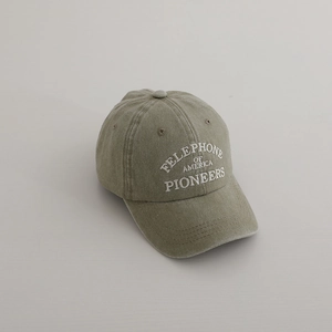 Close-up of vintage olive green washed cotton baseball cap with white letter embroidery
