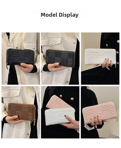 Detailed view of long textured wallets for women in four versatile colors held by a model
