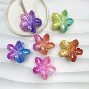 Colorful gradient plumeria hair claws set with iridescent finish for beach vacations