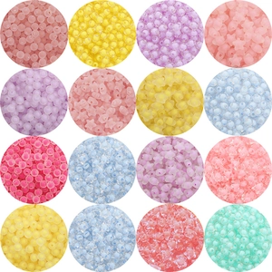 Macro display of colorful acrylic star and round beads in various frosted and clear finishes