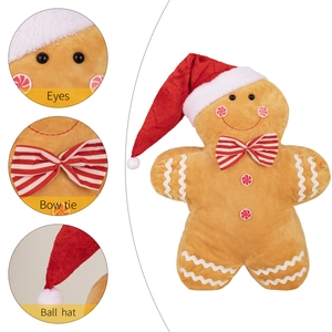 Gingerbread man plush toy with red Christmas hat and striped bow tie on white background