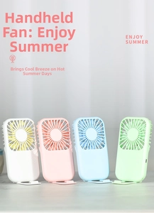 Macro view of portable mini USB fans in four colors with foldable hidden desk stand