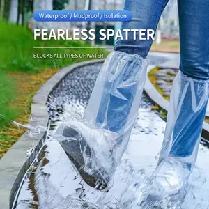 Tall waterproof clear shoe covers with elastic tops shown in wet outdoor puddle use