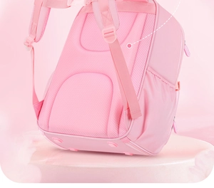 Close-up of pink schoolbag showing breathable mesh padding and ergonomic shoulder straps