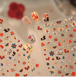 Close-up of Chinese New Year nail stickers with 3D embossed fortune and koi fish patterns