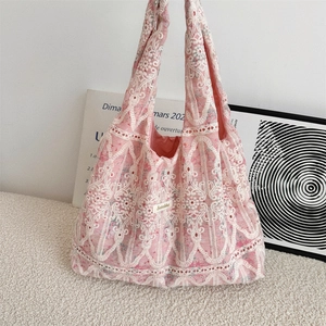 Pink lace tote bag with floral embroidery and cutout patterns in French vintage style