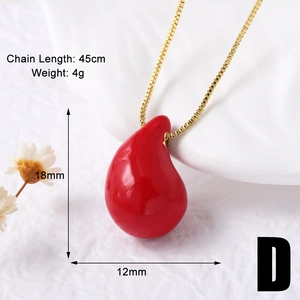 Detail shot of a red heart pendant necklace with dimensions 18mm x 12mm on gold box chain