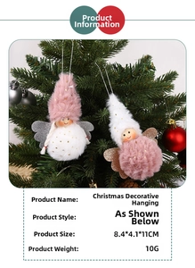 Close-up of plush angel hanging ornaments on a Christmas tree with wings and fuzzy details