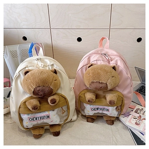 Detail of pink and white plush Capybara backpacks with transparent front display pockets