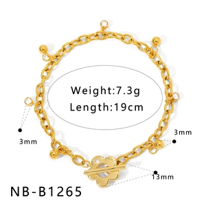 Detailed size and weight specs for gold chain bracelet with floral toggle clasp and charms