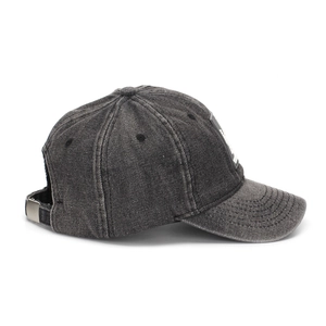 Detail of adjustable metal buckle and washed denim texture on charcoal baseball cap