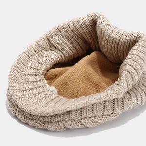 Beige cable knit newsboy hat with thermal fleece lining for winter warmth