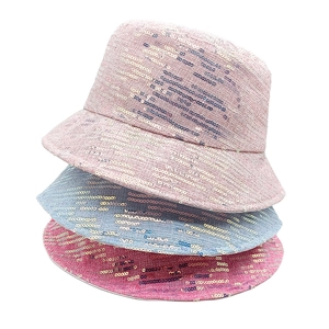 Detail of stacked sequined bucket hats in pink and blue with tweed texture