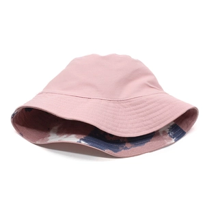 Detail showing dual-side design with solid pink canvas and tie-dye inner lining