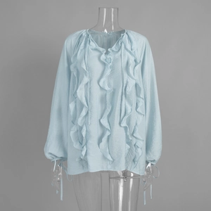 Detail of ruffled V-neck and drawstring lantern sleeves on light blue chiffon blouse
