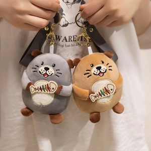 Cute otter plush keychains in grey and brown with fish bone embroidery and golden rings
