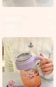 Close-up of 1000ml large capacity glass cup with lucky lettering and purple handle