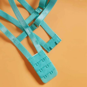 Detail of teal lace bra back closure with three-row hook and eye and adjustable strap
