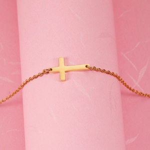 Polished gold stainless steel horizontal cross necklace with delicate cable chain