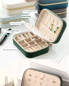 Detailed interior of velvet jewelry organizer box with necklace hooks and ring slots