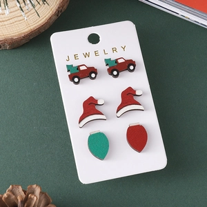 Christmas earrings set featuring red truck, santa hat, and colorful bulb studs
