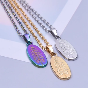 Detail showing oval pine tree relief pendants in gold silver and iridescent finishes