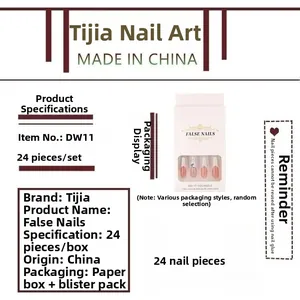 Detail view of pink ombre press-on nails with glitter diamonds in boxed packaging